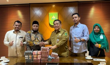 Diserahkan Sekdaprov ke Baznas Riau, ASN dan Tenaga Honorer Pemprov Riau Bantu Palestina Rp1,189 Miliar