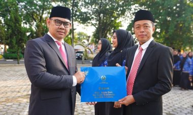 Kepala Bidang IKP Eriadi Fahmi Terima Satyalancana Karya Satya 10 Tahun, Diskominfotik Riau Gelar Upacara HUT ke-81 RI